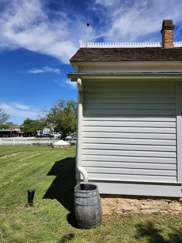 Rain barrel, lightning rod, and cistern at Lyndon Johnson's boyhood home in Johnson City, Texas.