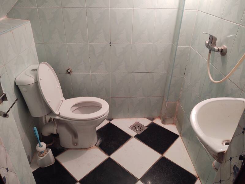 Shared toilet and sink at Karim Sahara guesthouse in Zagora.