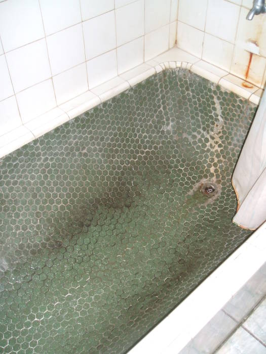 Tile-covered bathtub in Trinidad at Pearl's Guest House.