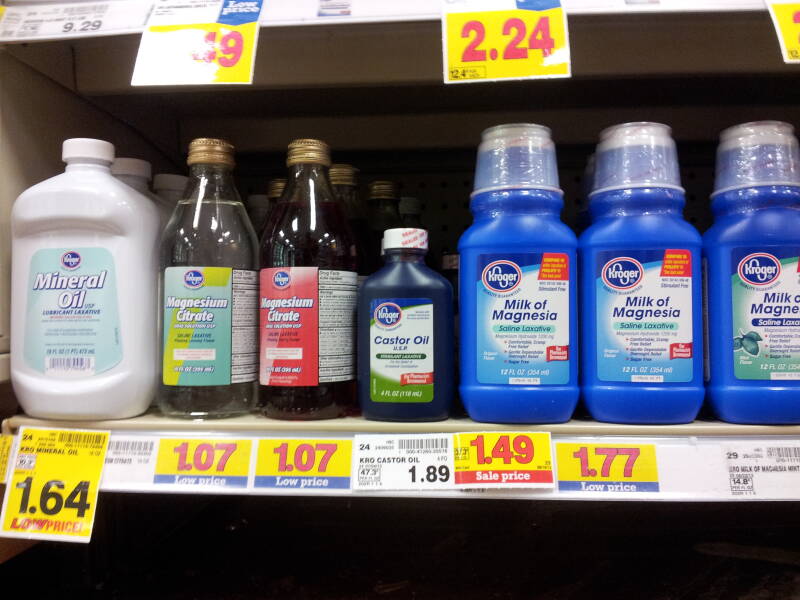 Bottles of laxatives: mineral oil, castor oil, and magnesium citrate.