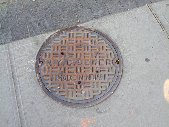 Manhole cover in Manhattan: 'N.Y.C. Sewer', 'Made in India', from General Foundries, Inc.
