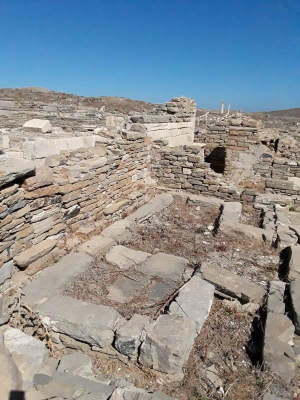 Public latrine along the west side of the Agora of the Italians, next to the Letoön, at Delos.