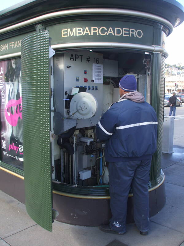 Man working on a French-style automated toilet in San Francisco.