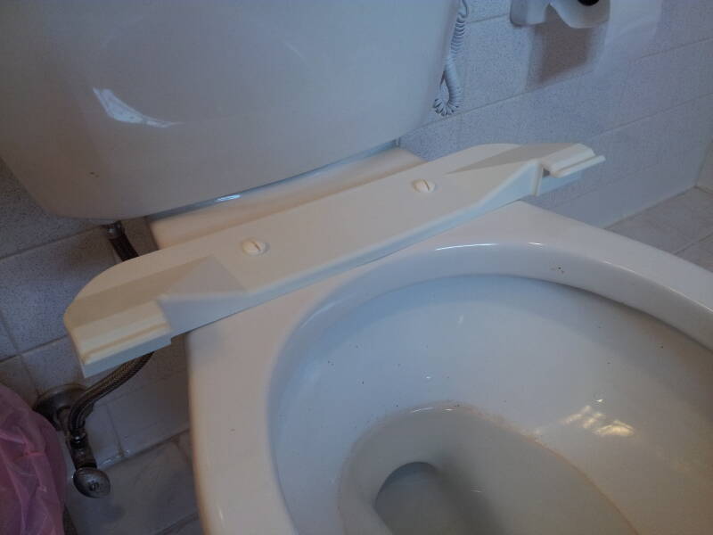 'Booster seat' added to a home toilet.