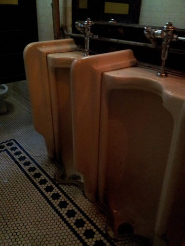 Urinals inside Old Town Bar on 18th Street in the Flatiron District.