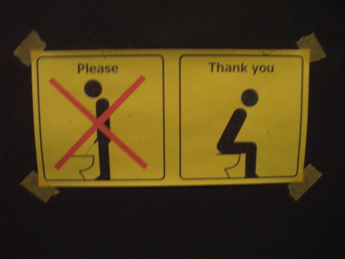 Sit down to pee! Instructional sign in the bathroom at Bar de Nikko, in Nikko.