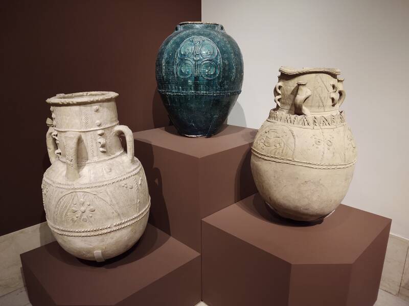 Three water storage jars; green-glazed one is attributed to Iran or Iraq, of the Umayyad or Abbāsid period, dating from the 7th to 9th century CE, at the Metropolitan Museum of Art in New York.