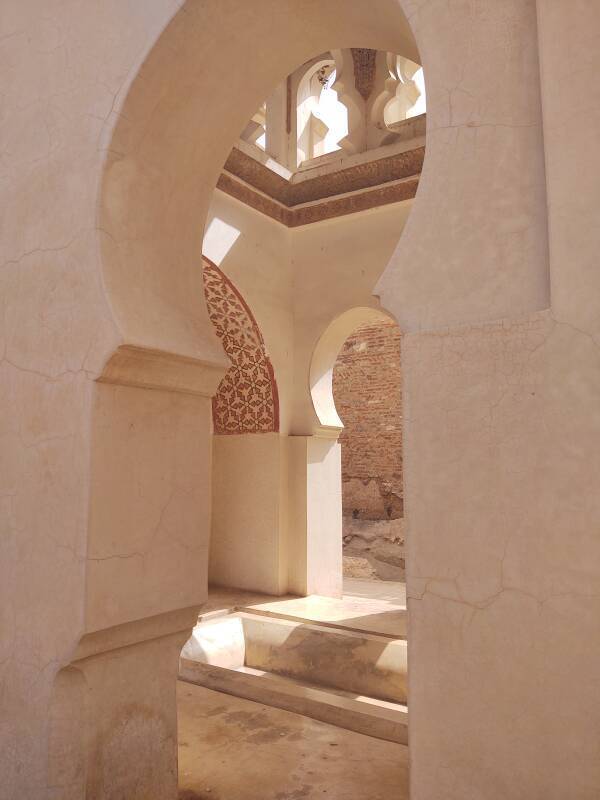 Keyhole arches and marble ablutions basin in the Qubba el-Ba'adiyyin in Marrakech, Morocco.