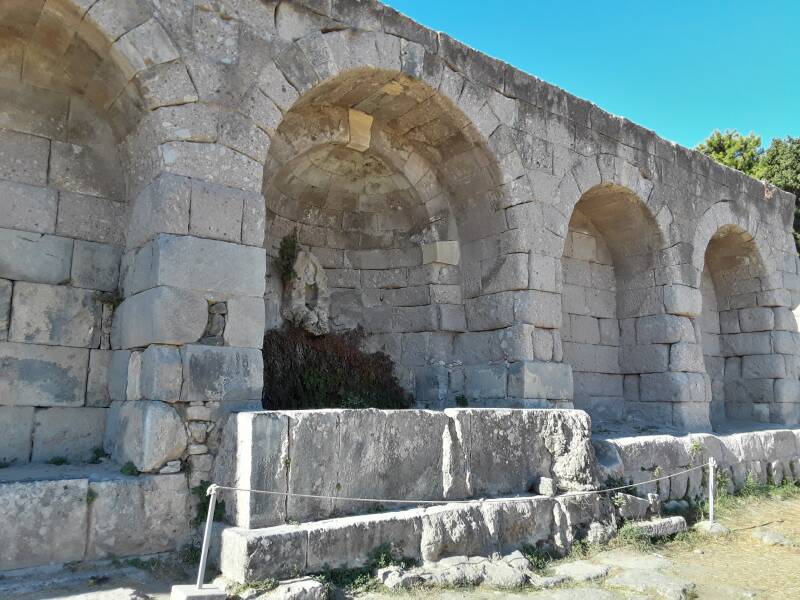 Fountain with relief of Pan in the arched wall at the rear of the First Terrace at the Asclepeion.