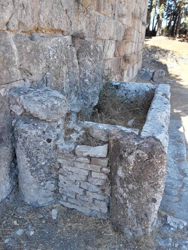Water basin near the public toilet area at the right rear corner of the First Terrace at the Asclepeion, as seen from the Middle Terrace.