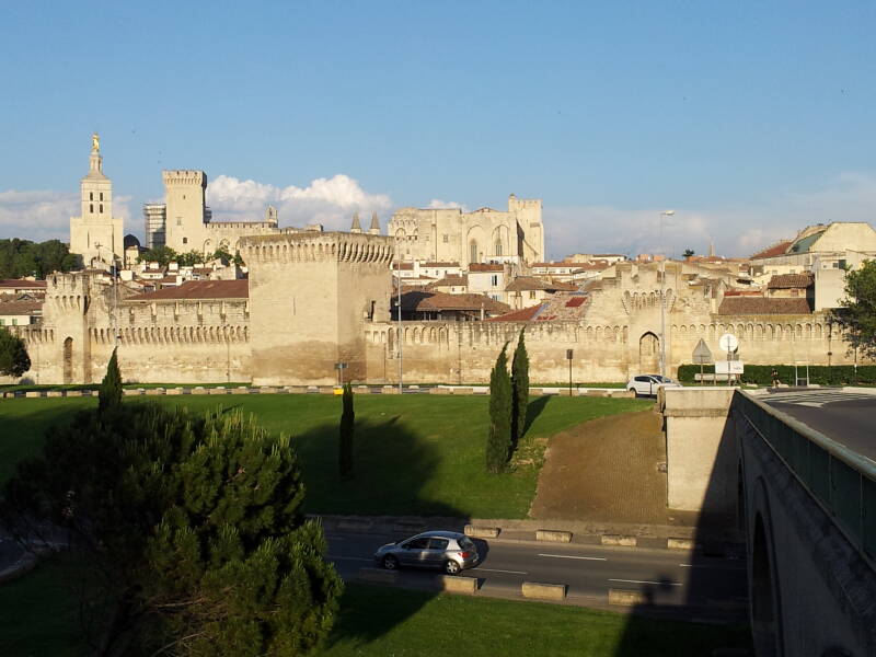 Rhône river, old city walls, and Palace of the Popes in Avignon.