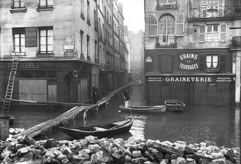 January 1910 flood of Quai des Grand-Augustins et rue Gît-le-Cœur from Bibliothèque nationale de France reproduced in https://commons.wikimedia.org/wiki/File:Paris_1910_Inondation_quai_des_Grands-Augustins_et_rue_G%C3%AEt-le-C%C5%93ur.jpg