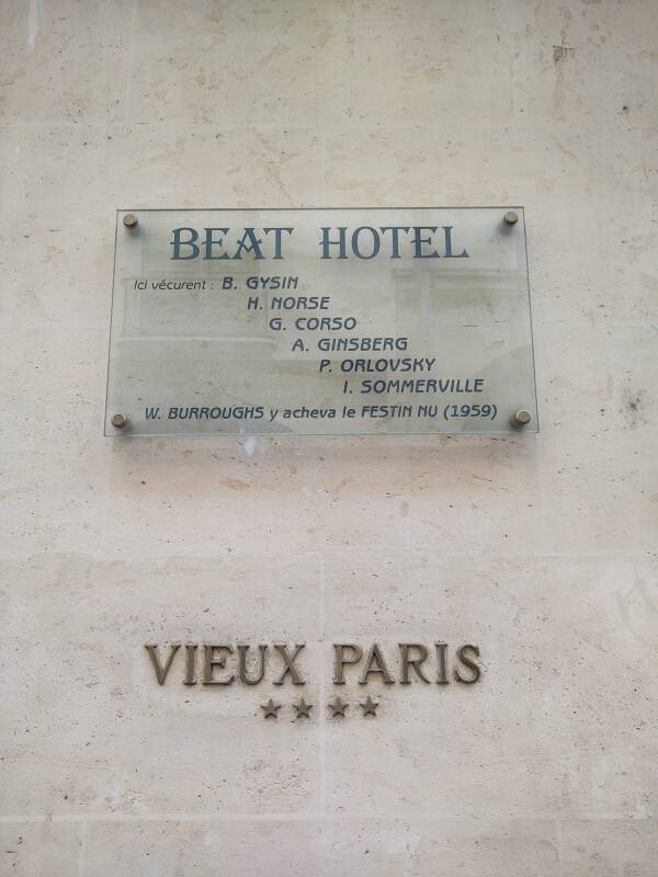 Glass plaque commemorating its earlier existence as the 'Beat Hotel': 'Here lived: B. Gysin, H. Norse, G. Gorso, A. Ginsberg, P. Orlovsky, I. Sommerville; W. Burroughs here finished Naked Lunch (1959)'