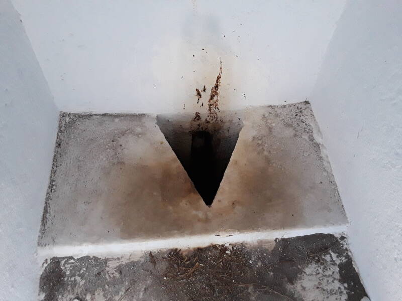 Squat toilet at the Church of the Prophet Elias along the caldera rim between Fira and Oia on Santorini.