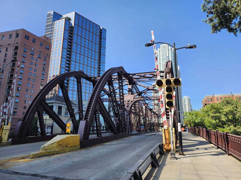 The anti-slip riveted steel grating deck of the Kinzie Street Bridge over the North Branch of the Chicago River.