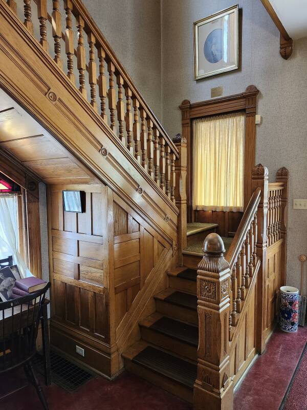 Staircase just inside the front door.