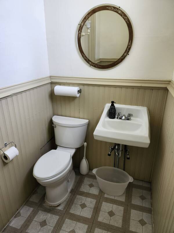 Toilet and sink in original bathroom of Eugene Debs' home.