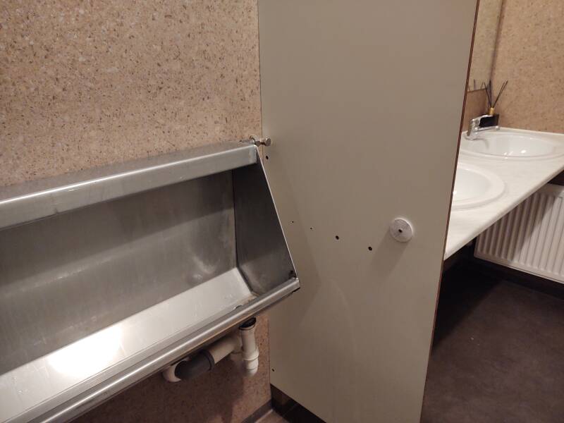 Steel trough urinal with infrared sensing system at Höfn.