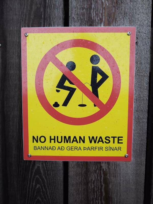 'No Human waste' sign at Steinahellir Cave along Highway #1, the Ring Road, in southern Iceland.