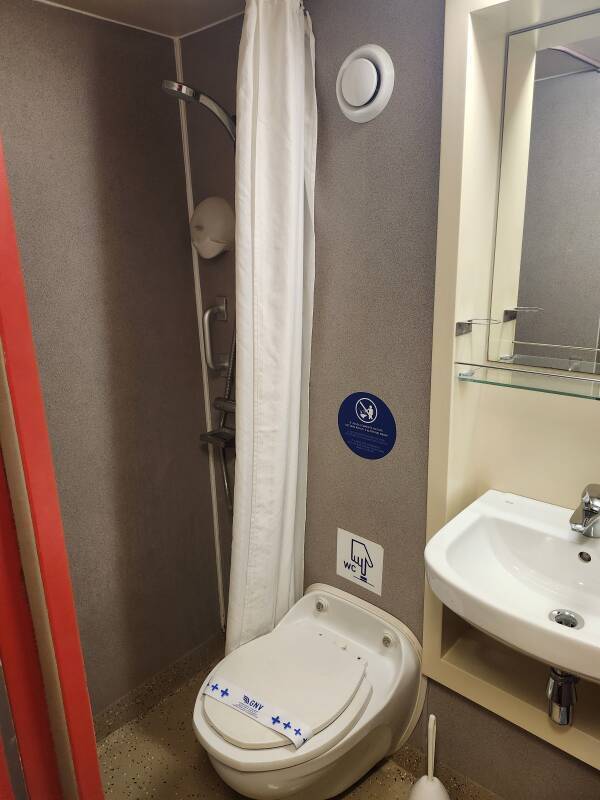 Shower, toilet, and sink in the head within my cabin.