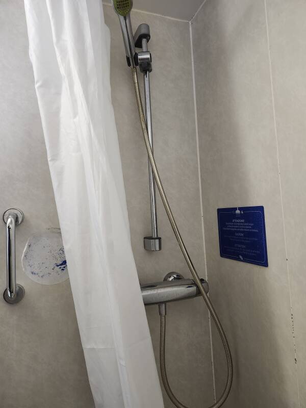Toilet and shower in the head within my cabin.