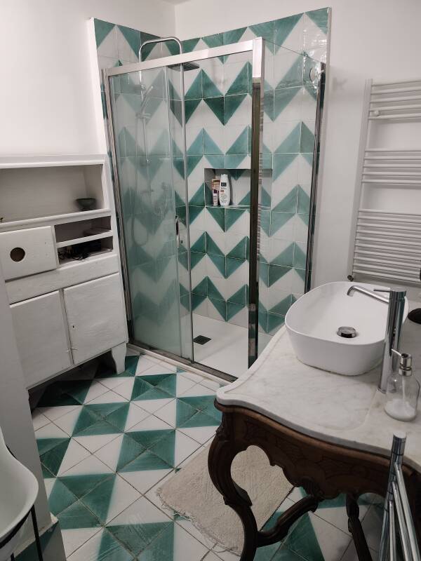Shower and sink at La Dimora del Merchese Notarbatrolo in Palermo.