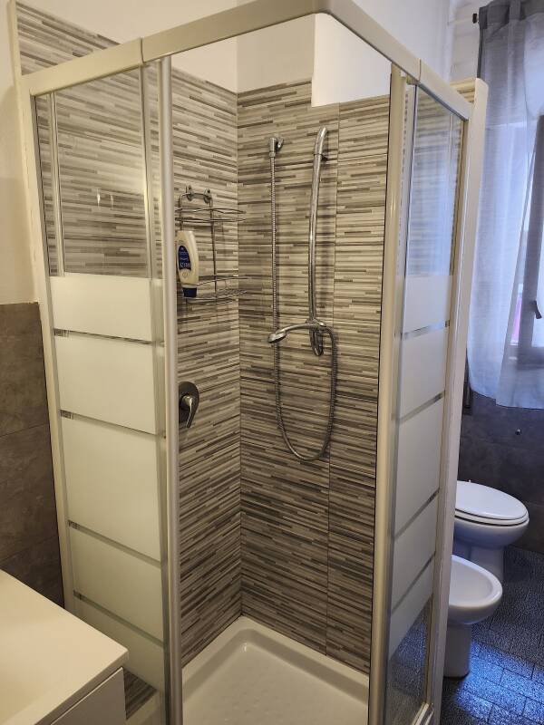 Sink, shower, bidet, and toilet at Papillon BnB in Palermo.