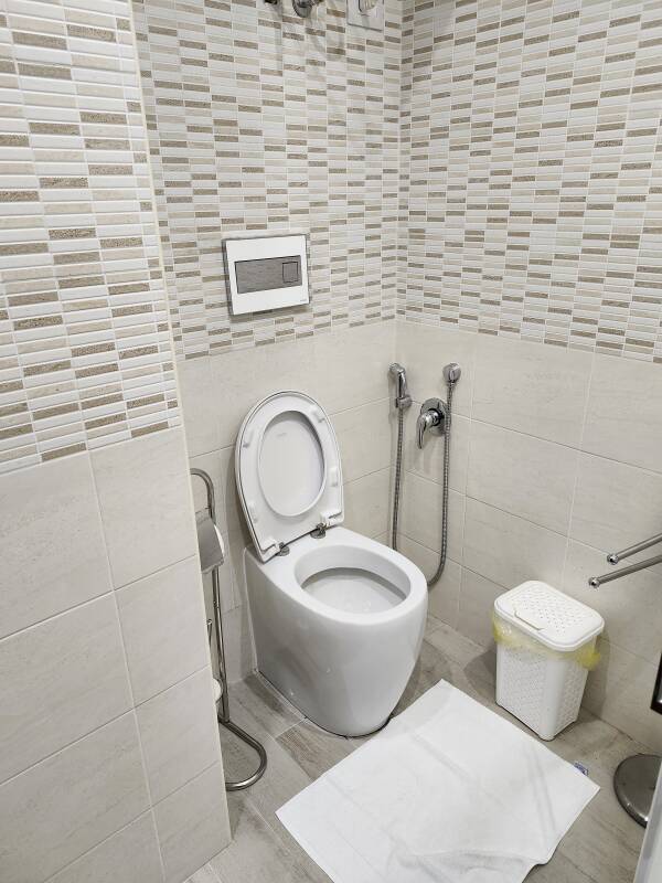 Toilet and hose with spray nozzle at I Mori Taormina in Taormina.