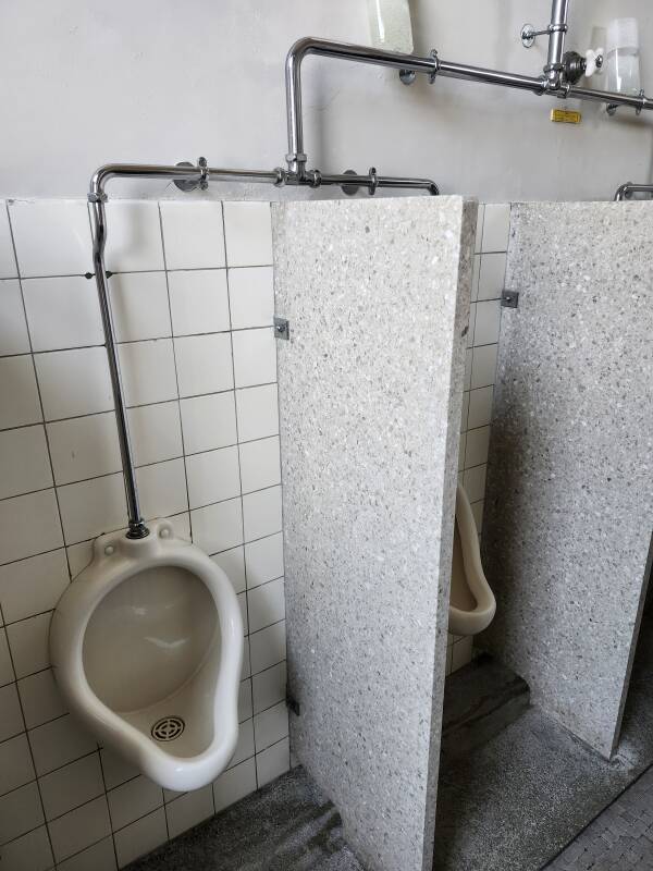 Array of four urinals from the 1950s.