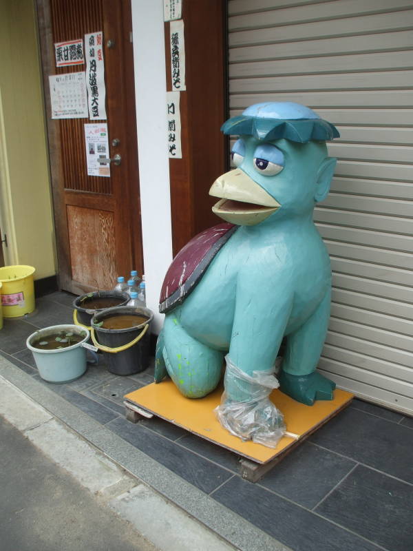 Kappa statue outside a kitchen supply store in Kappabashi-dori or Kitchen Town district of Tokyo.