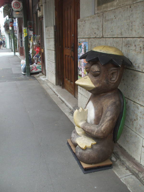 Kappa statue outside a kitchen supply store in Kappabashi-dori or Kitchen Town district of Tokyo.