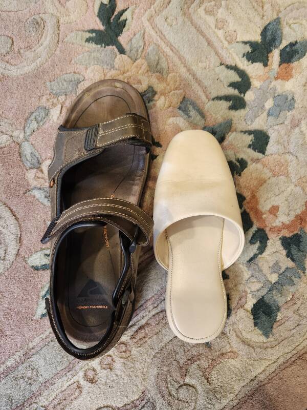 My sandal next to a hotel slipper.