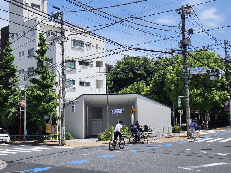 View of the Hatagaya Public Toilet, looking diagonally from the far corner of the intersection.