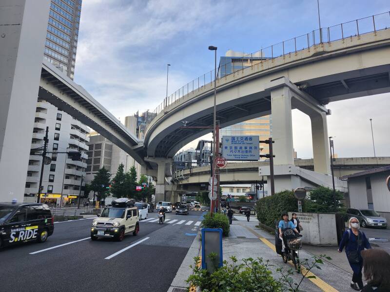 Walking underneath curving and branching elevated expressways and rail lines.