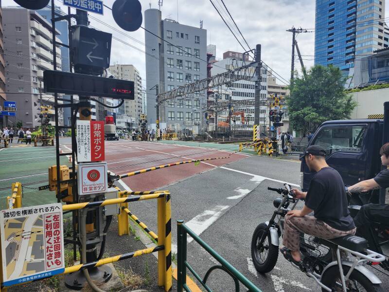 Street level crossing of rail lines on the south side of Shinjuku Station.