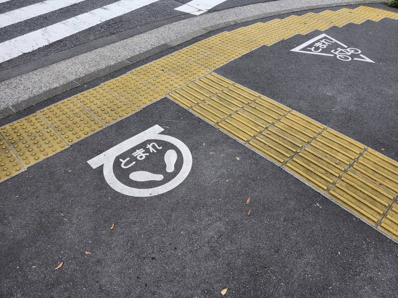 'Stop here' markers for pedestrians and bicyclists.