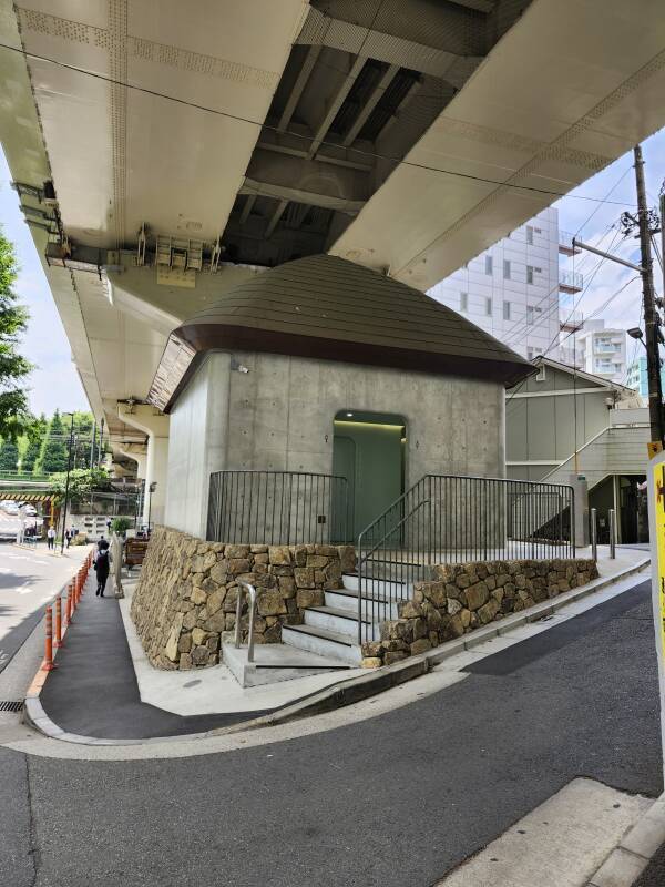 Urasando Public Toilet, under an elevated highway.