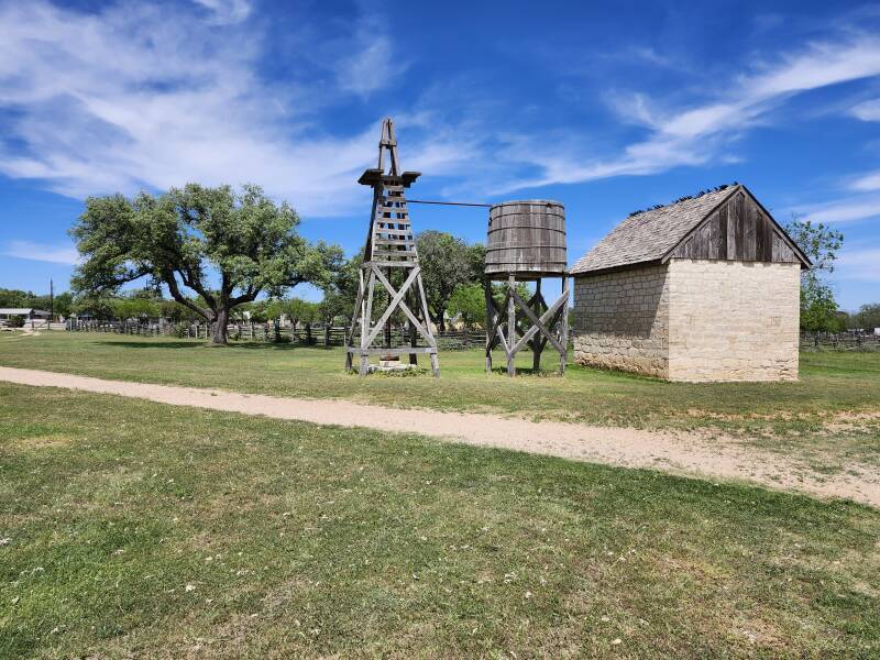 Windmill and water tank in the Johnson Settlement.