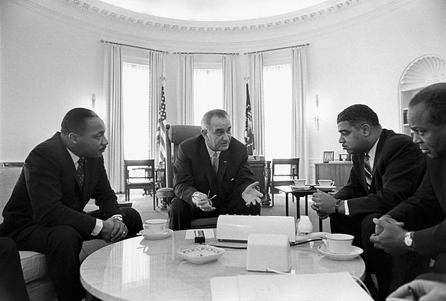 Johnson meeting with civil rights leaders Martin Luther King Jr. (left), Whitney Young, and James Farmer on January 18, 1964.