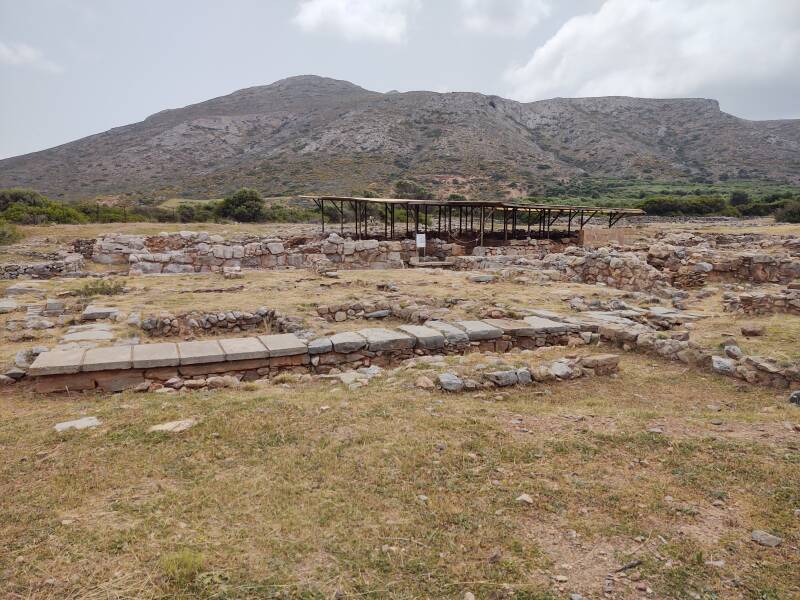 Covered mudbrick structures in the Minoan port city of Roussolakkos in far eastern Crete. Mount Petsofas in the background.