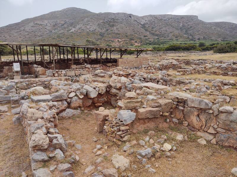 Covered mudbrick structures in the Minoan port city of Roussolakkos in far eastern Crete. Mount Petsofas in the background.