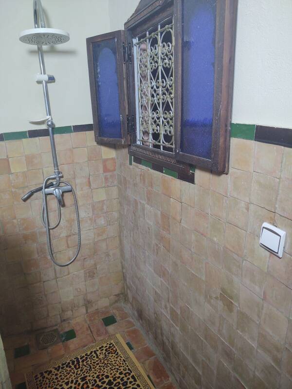 Shower next to a window at a riad-style guesthouse in the medina in Meknès.