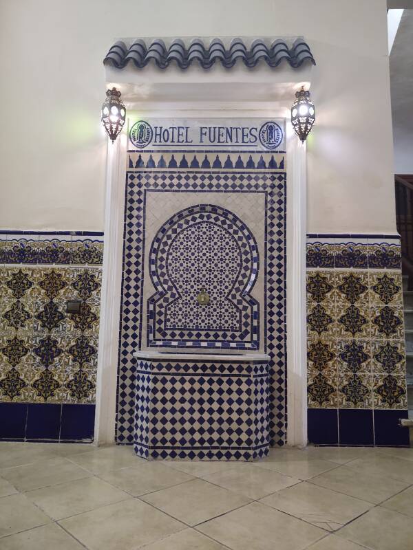 Fountain in the hallway on the café level at Hôtel Fuentes in Tangier.