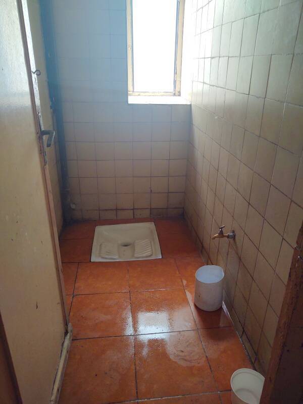 Squat toilet on the café level at Hôtel Fuentes in Tangier.