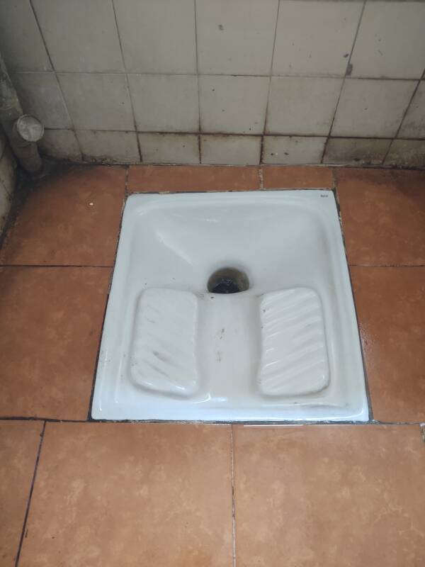 Squat toilet on the café level at Hôtel Fuentes in Tangier.