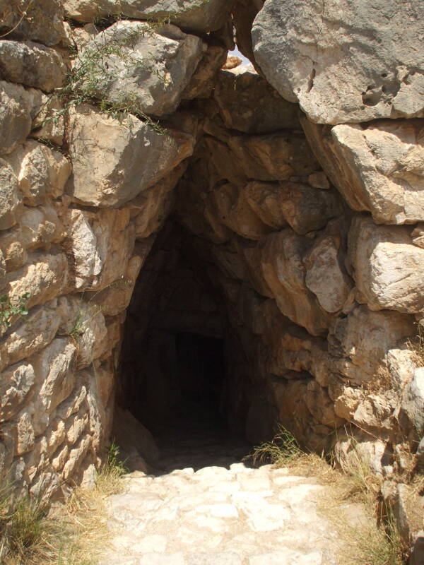 Stone tunnel staircase leading to a large underground water cistern at Mycenae.