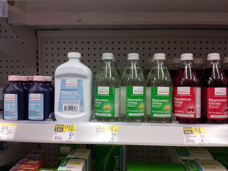 Bottles of laxatives: mineral oil, castor oil, and magnesium citrate.
