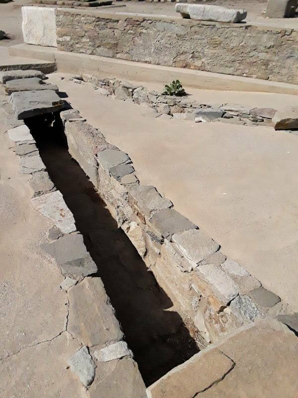 Drain associated with public latrine along the west side of the Agora of the Italians, just south of the Letoön, at Delos.