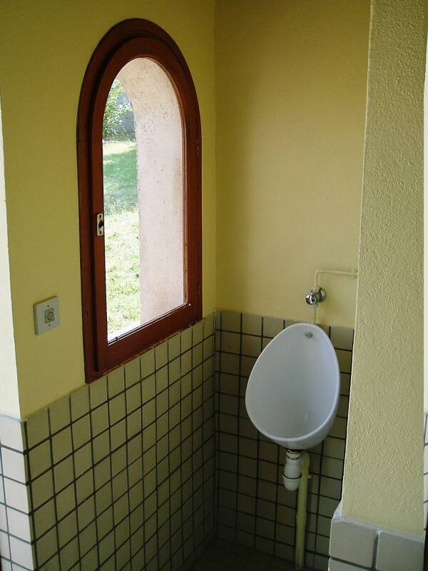 Looking out the window from a urinal in central France.