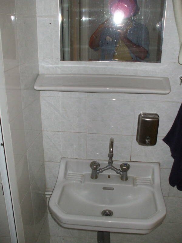 Typical sink and mirror in the Students' and Travelers' Inn, in Athens.